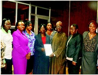 Director, Narcotics and Controlled Substances, Pharm. (Alh) Hashim Ubale Yusufu (middle), receiving the condolence letter on behalf of DG, NAFDAC from Pharm. (Mrs) Modupe Ologunagba, chairperson, ALPs, Lagos State chapter and other members.