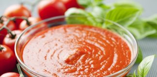 bowl of tomato pulp, pure, sauce, basil leaves