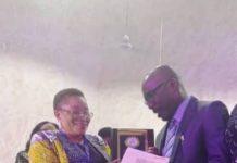 Prof. Cyril Usifoh, receiving an Award Plaque from the Vice-chancellor of UNIBEN, Prof.